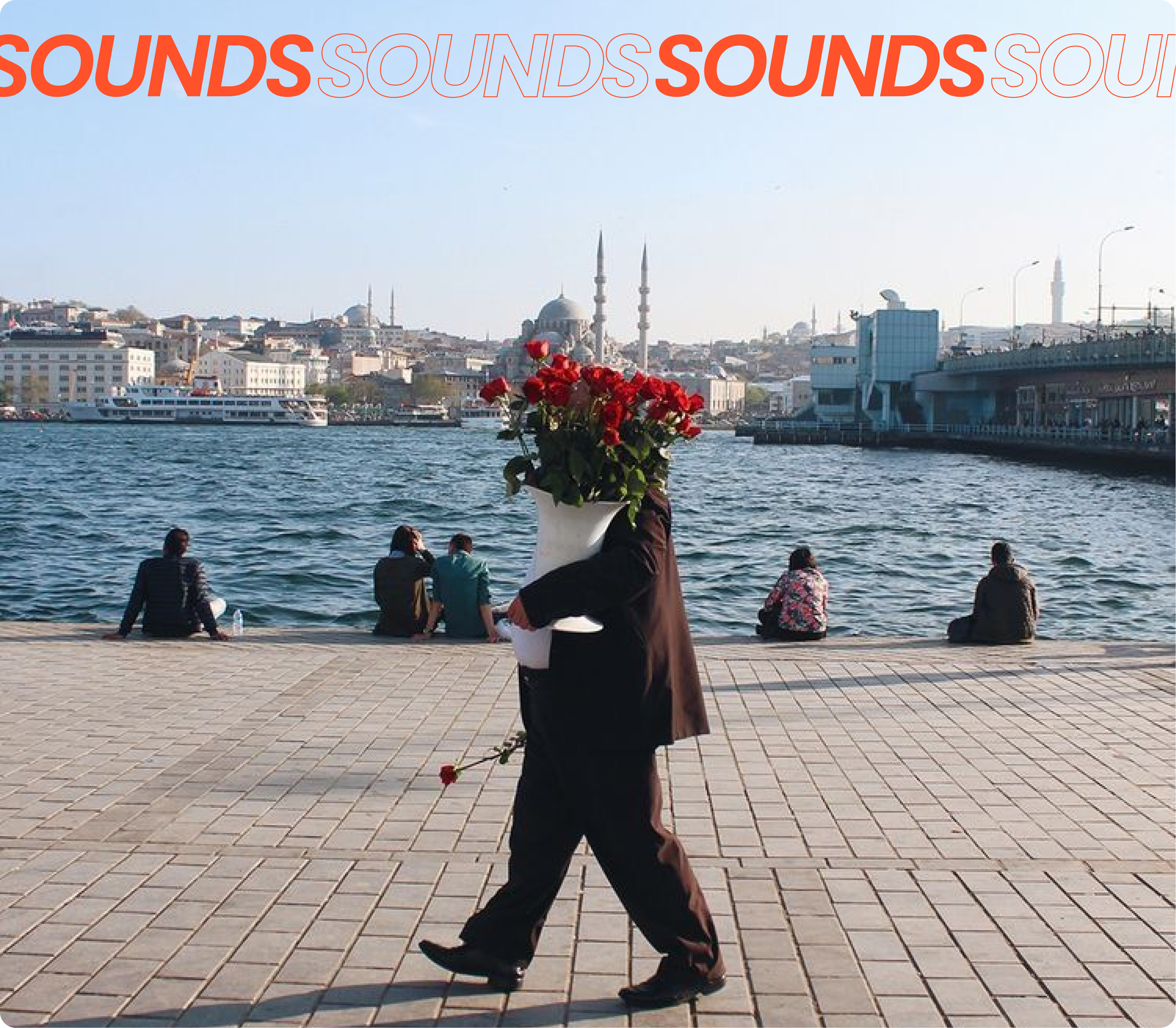 Portrait of the blog owner with face partially distorted through two clear glasses of water on a white table